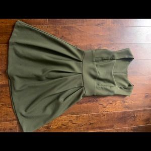 Green dress. Perfect for business attire.